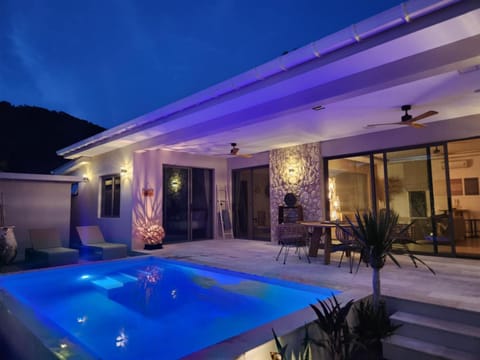 Property building, Patio, Night, Pool view, Swimming pool, sunbed