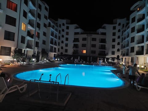 Property building, Patio, Night, Pool view, Swimming pool, sunbed
