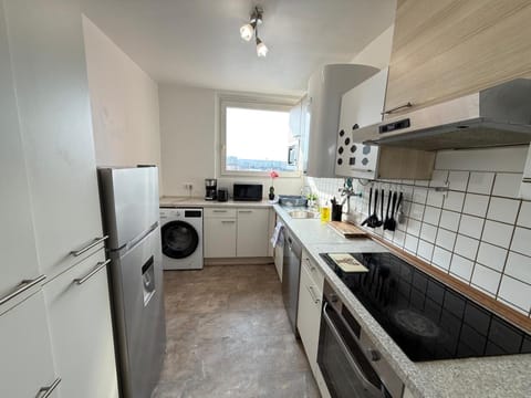 Kitchen or kitchenette, dishwasher, oven, stove, toaster, washing machine