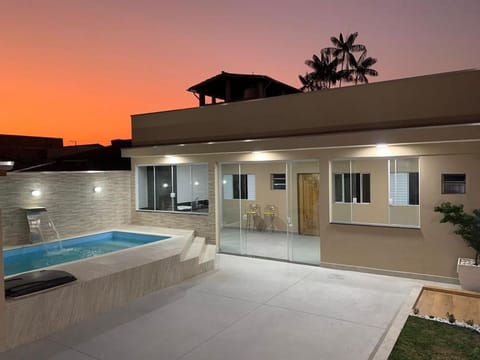Property building, Patio, Natural landscape, Pool view, Swimming pool, Sunset