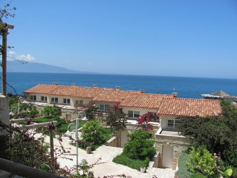 Property building, Nearby landmark, Facade/entrance, Day, Natural landscape, Beach, Landmark view, Mountain view, Pool view, Sea view
