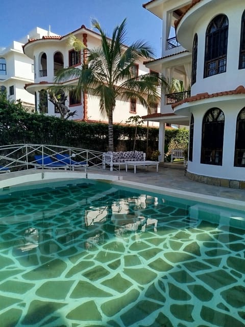 Property building, Pool view, Swimming pool, sunbed