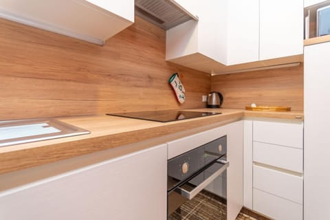 Kitchen or kitchenette, oven, stove