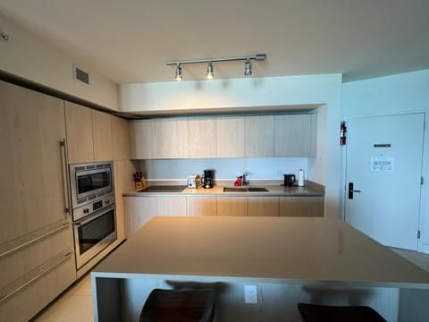 Kitchen or kitchenette, dishwasher, oven, stove, toaster