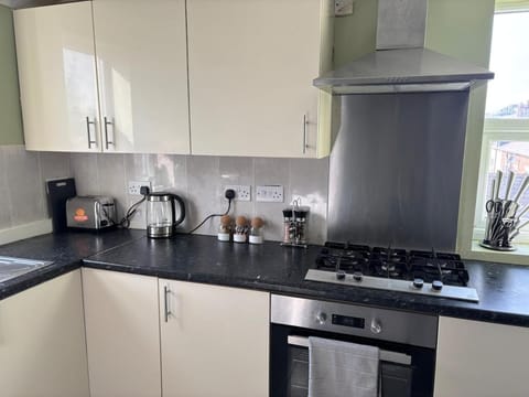 Kitchen or kitchenette, stove, toaster