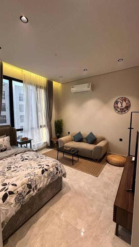 Bed, TV and multimedia, Living room, Seating area, Bedroom, air conditioner