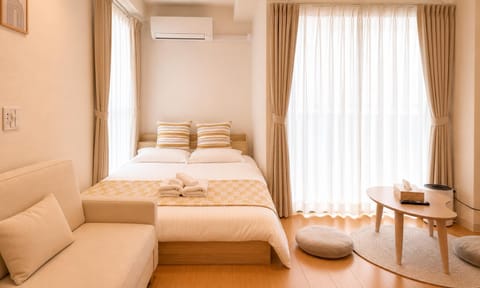 Bed, Photo of the whole room, Decorative detail, Bedroom, towels, air conditioner