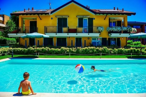 Property building, Day, Pool view, Swimming pool, children, sunbed