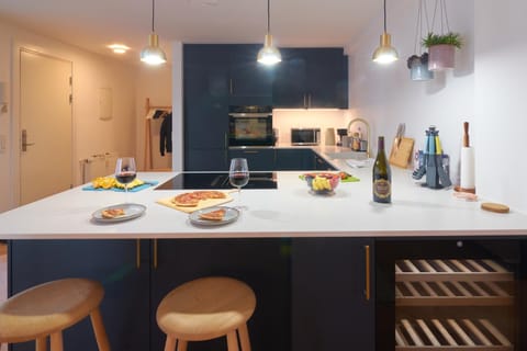 Kitchen or kitchenette, dishwasher, oven, stove