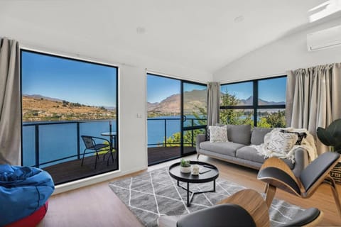 View (from property/room), Balcony/Terrace, Living room, Seating area, Lake view, Mountain view