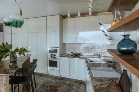 Photo of the whole room, microwave, oven, stove, wardrobe, kitchen