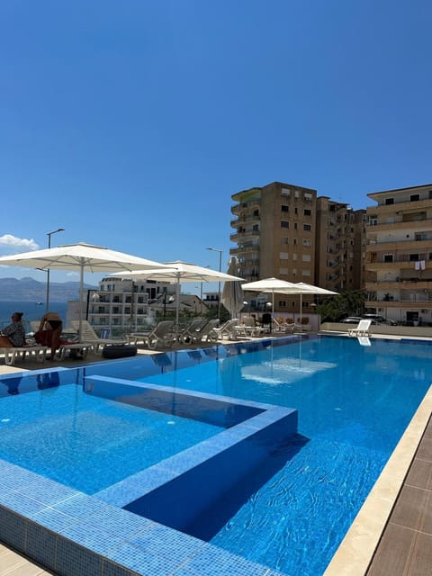 Property building, Pool view, Swimming pool, sunbed