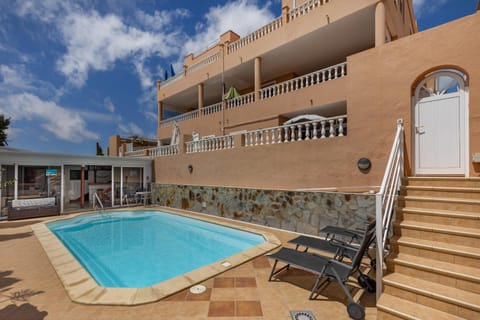 Property building, Living room, Swimming pool