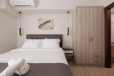 Bed, towels, wardrobe