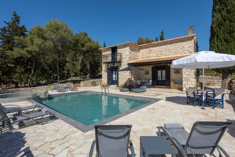 Property building, Patio, Pool view, Swimming pool, sunbed