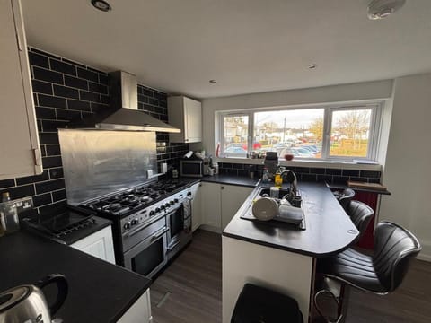 Kitchen or kitchenette, dishwasher, oven, stove, toaster