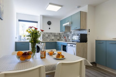 Dining area, microwave, oven, stove, washing machine, dryer, kitchen