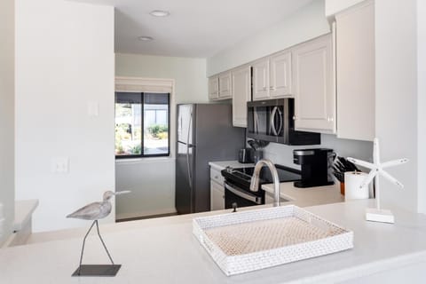 Kitchen or kitchenette, dishwasher, oven, stove