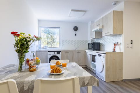 Dining area, microwave, oven, washing machine, dryer, kitchen