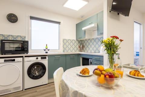 Dining area, microwave, oven, stove, washing machine, dryer, kitchen
