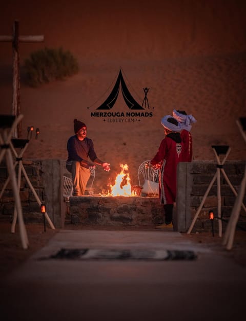 People, group of guests, fireplace