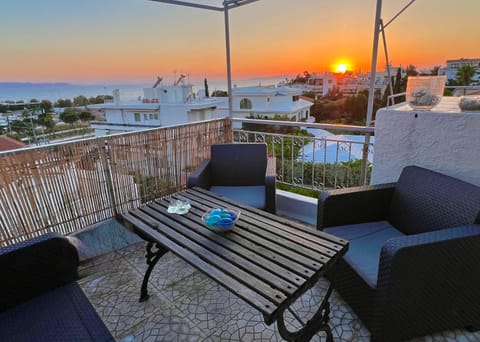 View (from property/room), Balcony/Terrace, Seating area, Garden view, Sea view, Sunset