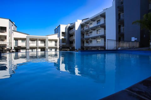 Property building, Day, Pool view, Swimming pool, sunbed