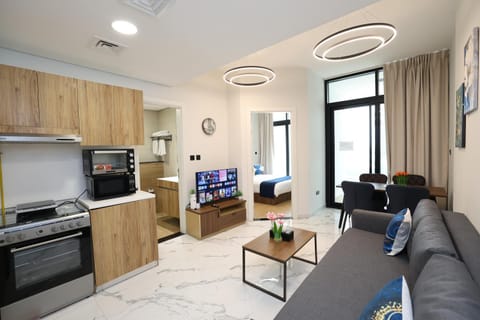 TV and multimedia, Kitchen or kitchenette, Living room, Seating area, Dining area, microwave, toaster, air conditioner