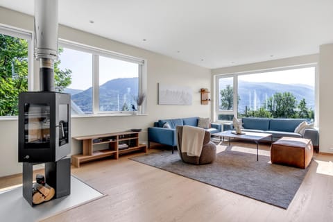 View (from property/room), Living room, Seating area, Garden view, Mountain view, fireplace