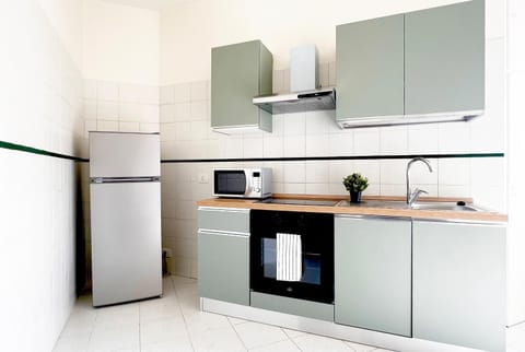 Kitchen or kitchenette, dishwasher, oven, stove, toaster