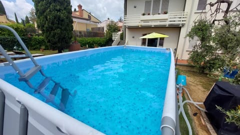 Property building, Garden, Pool view, Swimming pool, sunbed