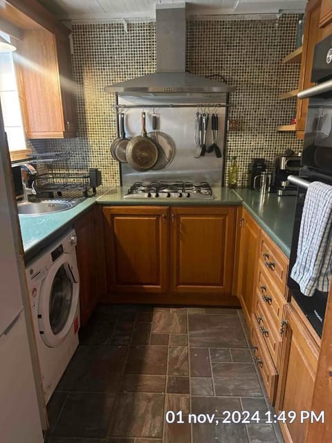 Kitchen or kitchenette, oven, stove, washing machine, dryer