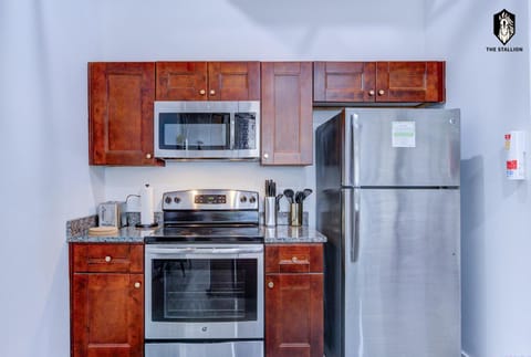 Kitchen or kitchenette, dishwasher, oven, stove, toaster