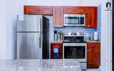 Kitchen or kitchenette, dishwasher, oven, stove, toaster