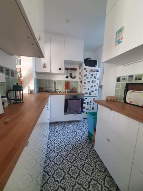 Kitchen or kitchenette, dishwasher, oven, stove