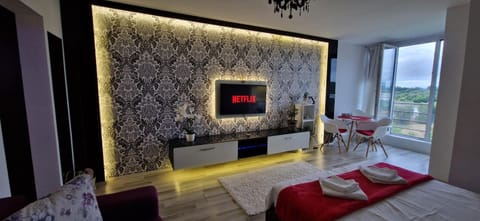 Bed, TV and multimedia, Living room, Seating area, City view