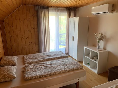 Bed, towels, wardrobe, air conditioner