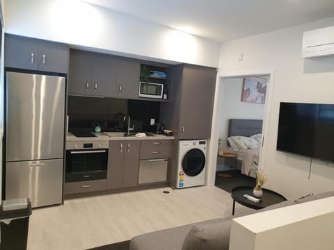 Kitchen or kitchenette, toaster, washing machine