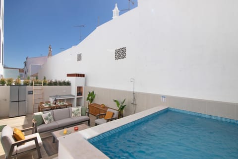 Property building, Living room, Swimming pool