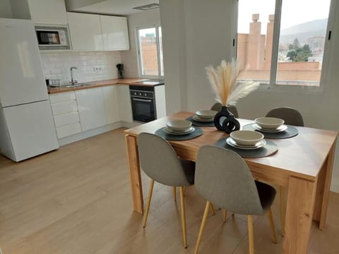 Kitchen or kitchenette, City view, microwave, oven