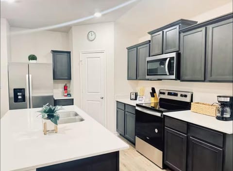 Kitchen or kitchenette, dishwasher, oven, stove, toaster