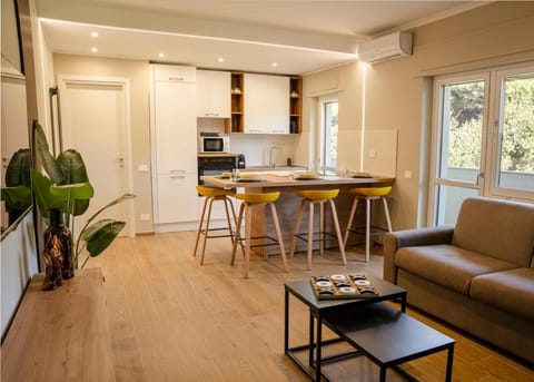 Kitchen or kitchenette, Living room, Seating area, Dining area, oven, stove, air conditioner