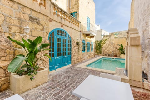 Property building, Patio, Day, Pool view, Swimming pool