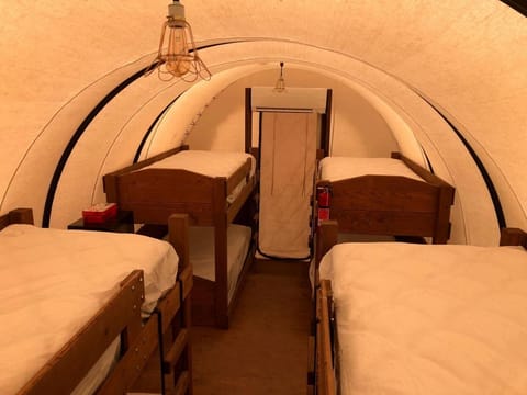 Perfect Glamping Vacations in this Rustic Conestoga Covered Wagon Rental in Oklahoma House in Norman