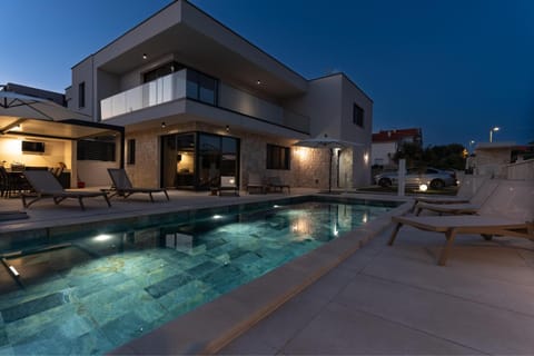 Patio, Night, Pool view, Swimming pool, sunbed