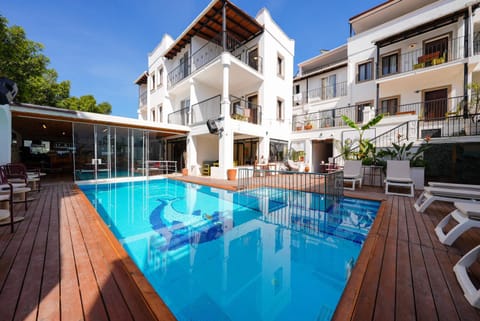 Property building, Patio, Communal lounge/ TV room, Day, Evening entertainment, Pool view, Swimming pool, sunbed