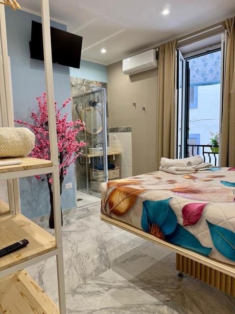 Bed, Photo of the whole room, Seating area, Bedroom, towels, wardrobe, air conditioner