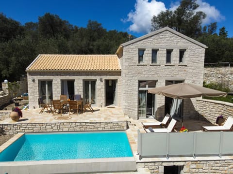 Property building, Patio, Day, Natural landscape, Pool view, Swimming pool, Swimming pool, sunbed
