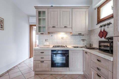 Kitchen or kitchenette, dishwasher, oven, stove, toaster