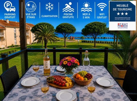 Patio, Day, Property logo or sign, Natural landscape, Summer, View (from property/room), Balcony/Terrace, Dining area, Logo/Certificate/Sign, Lake view, Mountain view, Swimming pool